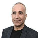 Portrait of a middle-aged man with short gray hair, wearing a dark blazer over a black shirt, smiling at the camera against a plain white background—perfect for introducing topics on the evolving cybersecurity landscape in your next video.